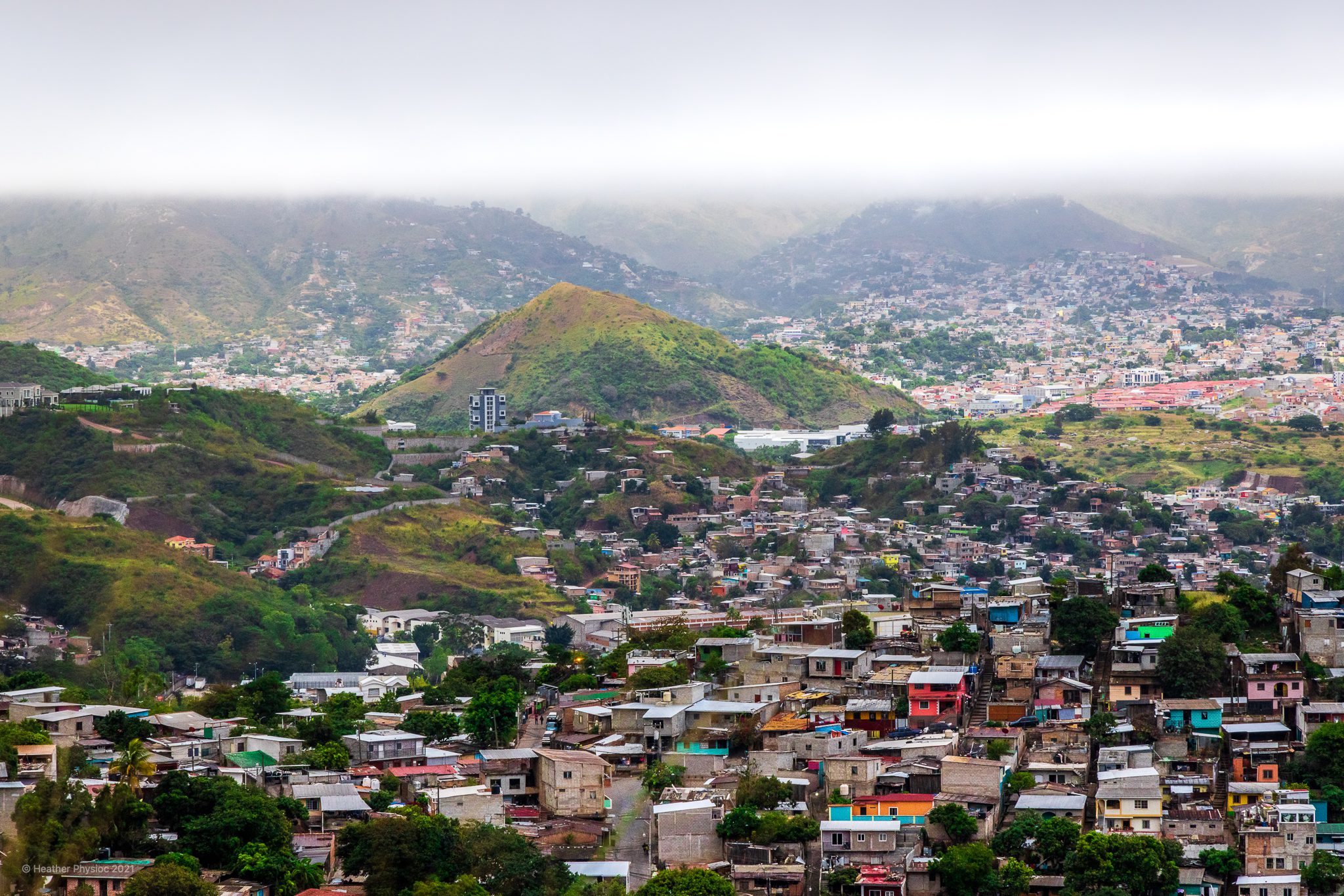 Colorful Houses Nestled At the Foot of a Mountain with Cloudy, Foggy Scene at Picacho in Tegucigalpa, Honduras
