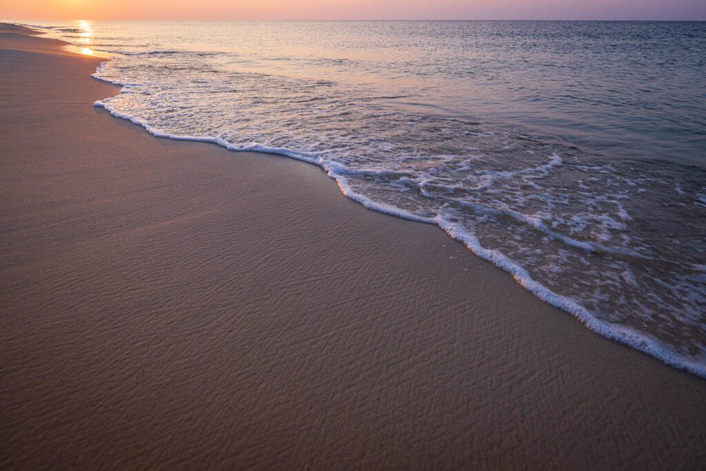 Bubbles in the surf on textured sandy Gulf of Mexico beaches in Gulf Shores, coastal Alabama
