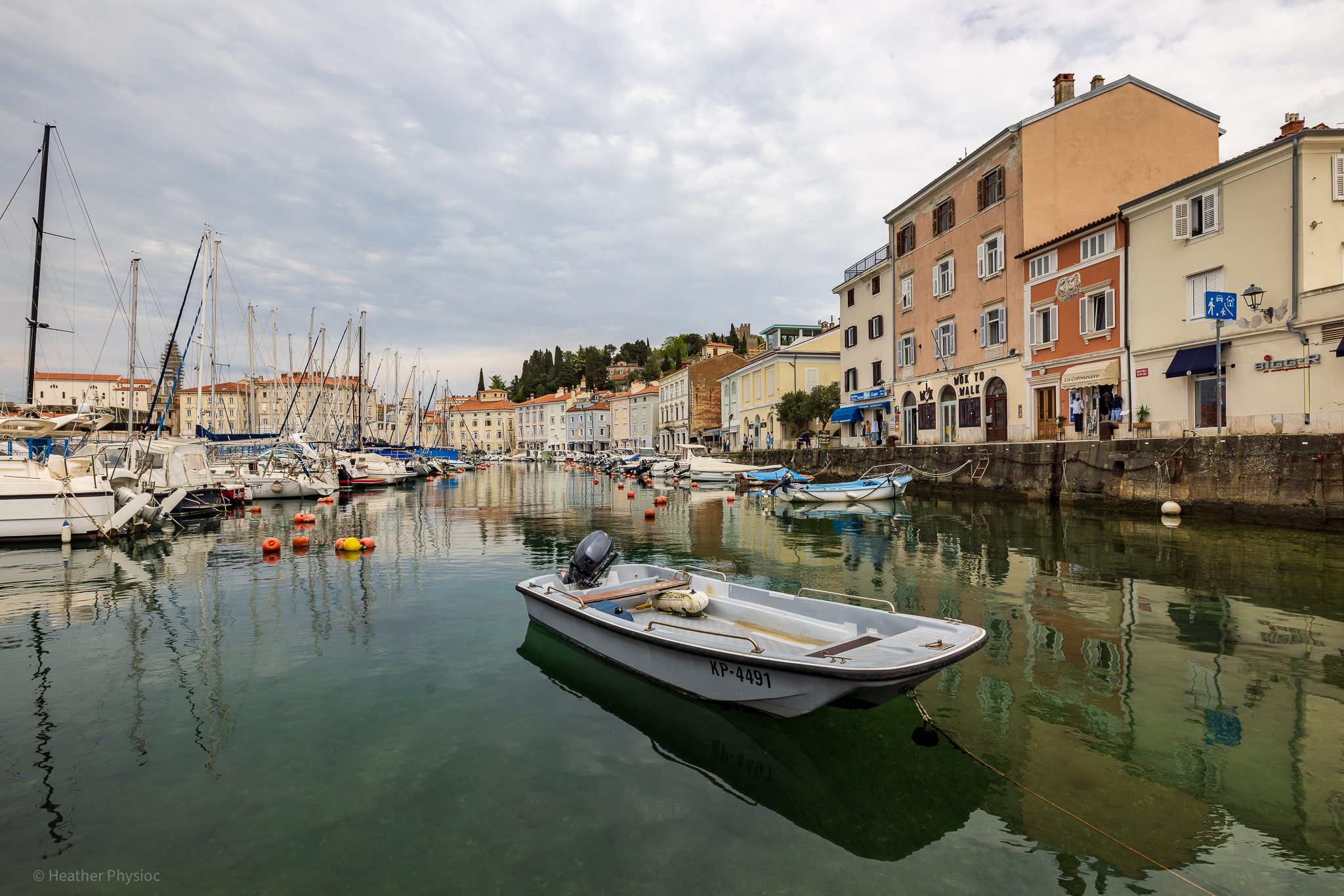 wide-angle-boat-anchored-piran-slovenia-marina