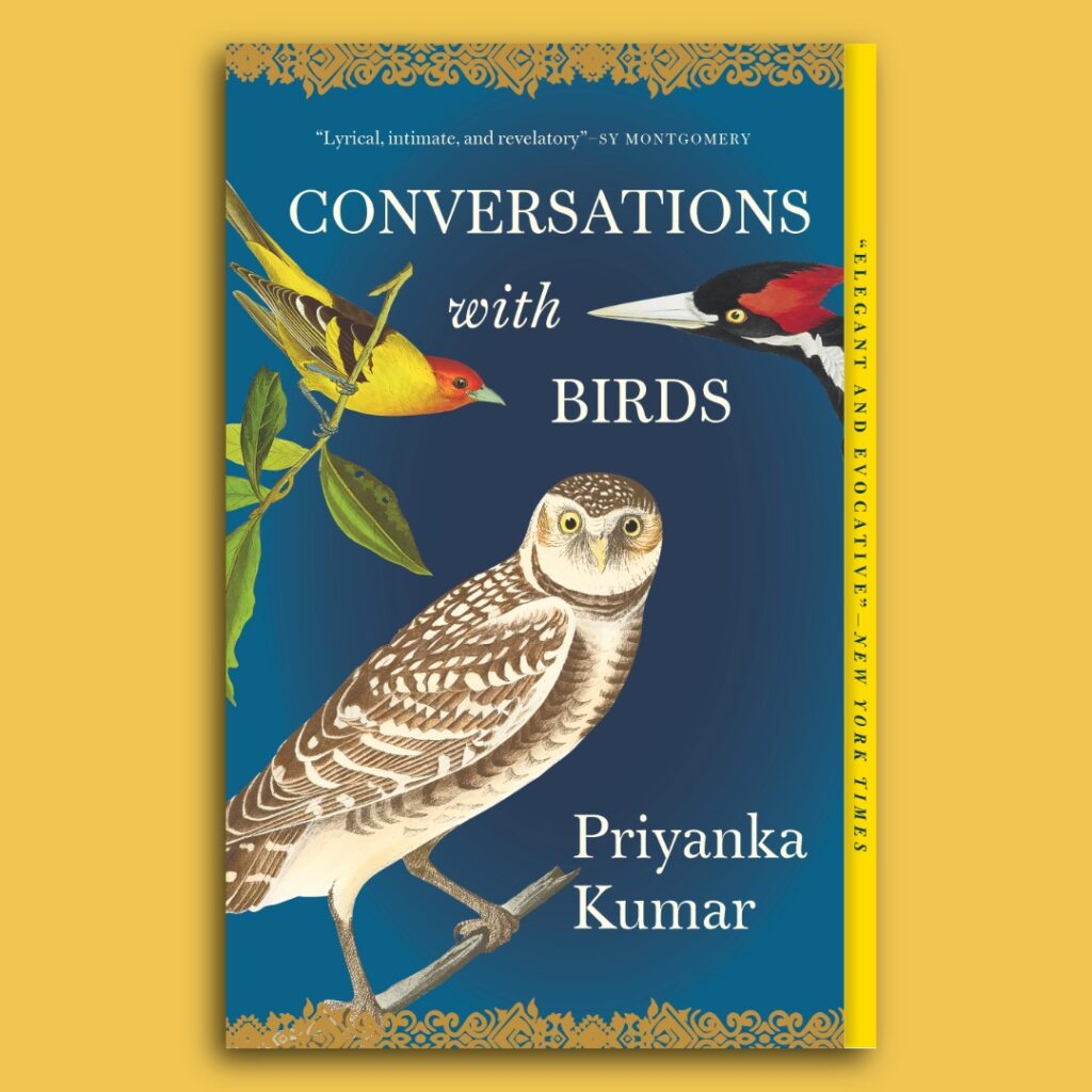 Book review image of the book cover for Conversations with Birds (2022), a nonfiction essay collection by Priyanka Kumar. The cover features illustrated birds—including an owl and songbirds—set against a deep blue background, reflecting themes of attention, listening, and coexistence with wildlife.