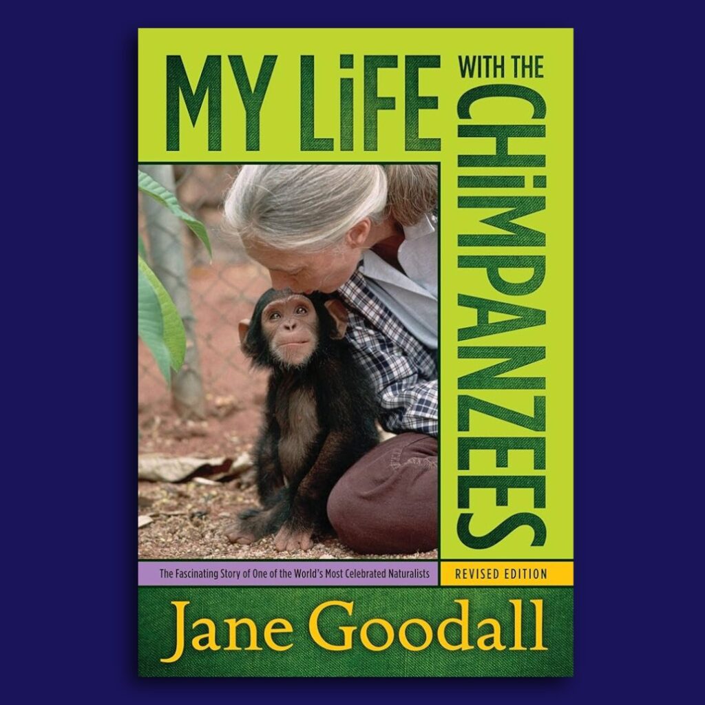 Book review image of the book cover for My Life with the Chimpanzees (1988), a nonfiction autobiography by Jane Goodall. The cover shows Goodall seated on the ground beside a young chimpanzee, highlighting her close, compassionate relationship with wildlife and her pioneering fieldwork.